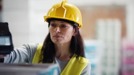 Adult-caucasian-woman-working-in-warehouse.